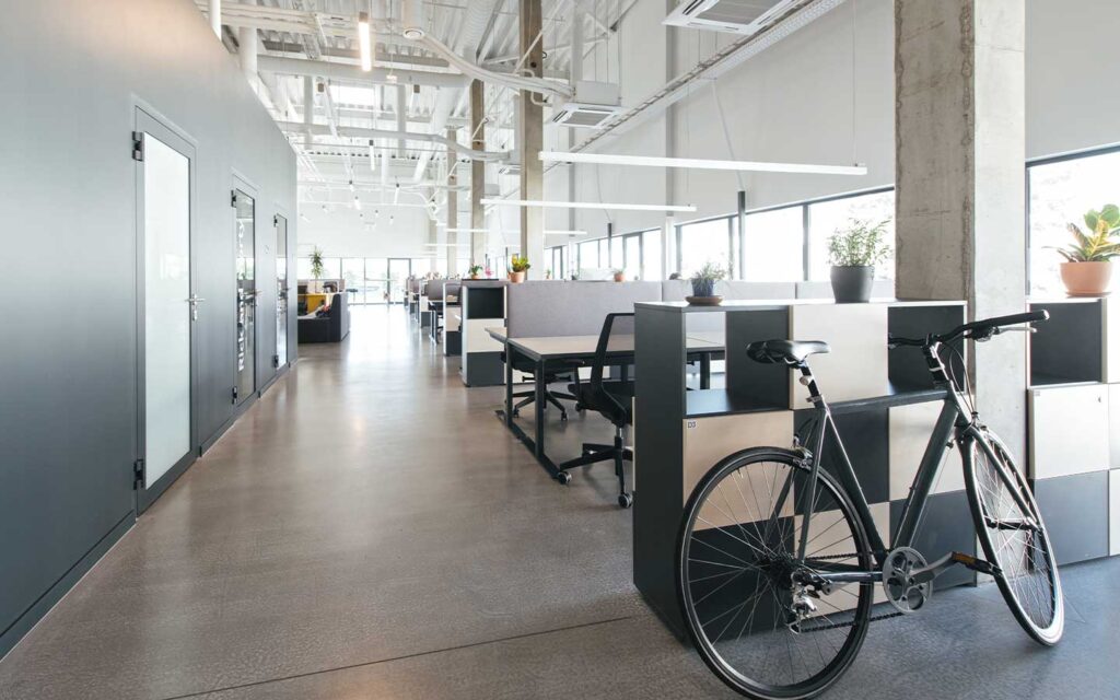 Large modern office with desks and bookshelves